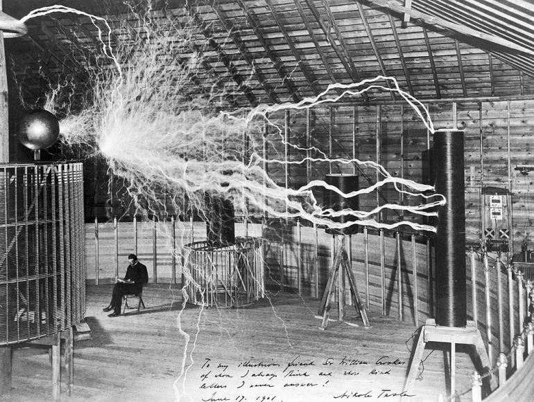 Nikola Tesla, with his equipment